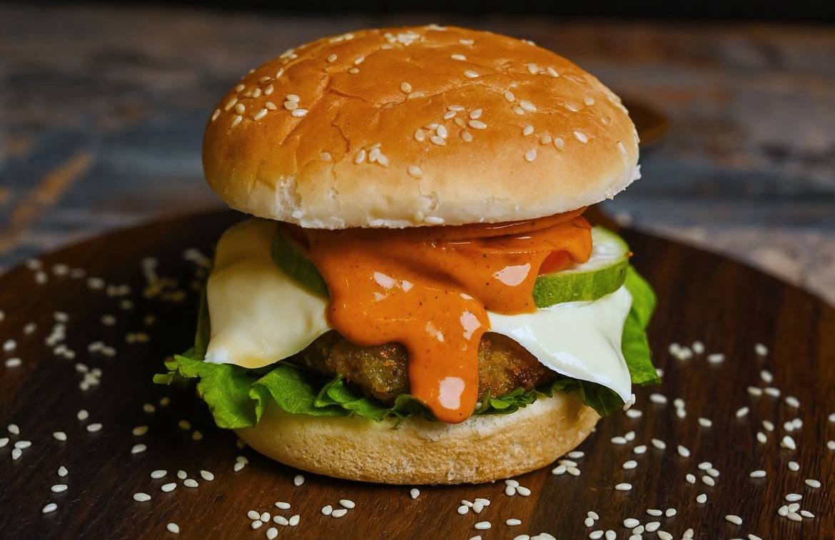 Signature burger with melted cheese